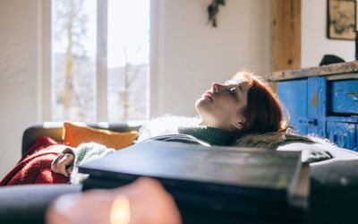 Woman having a nap at home. 